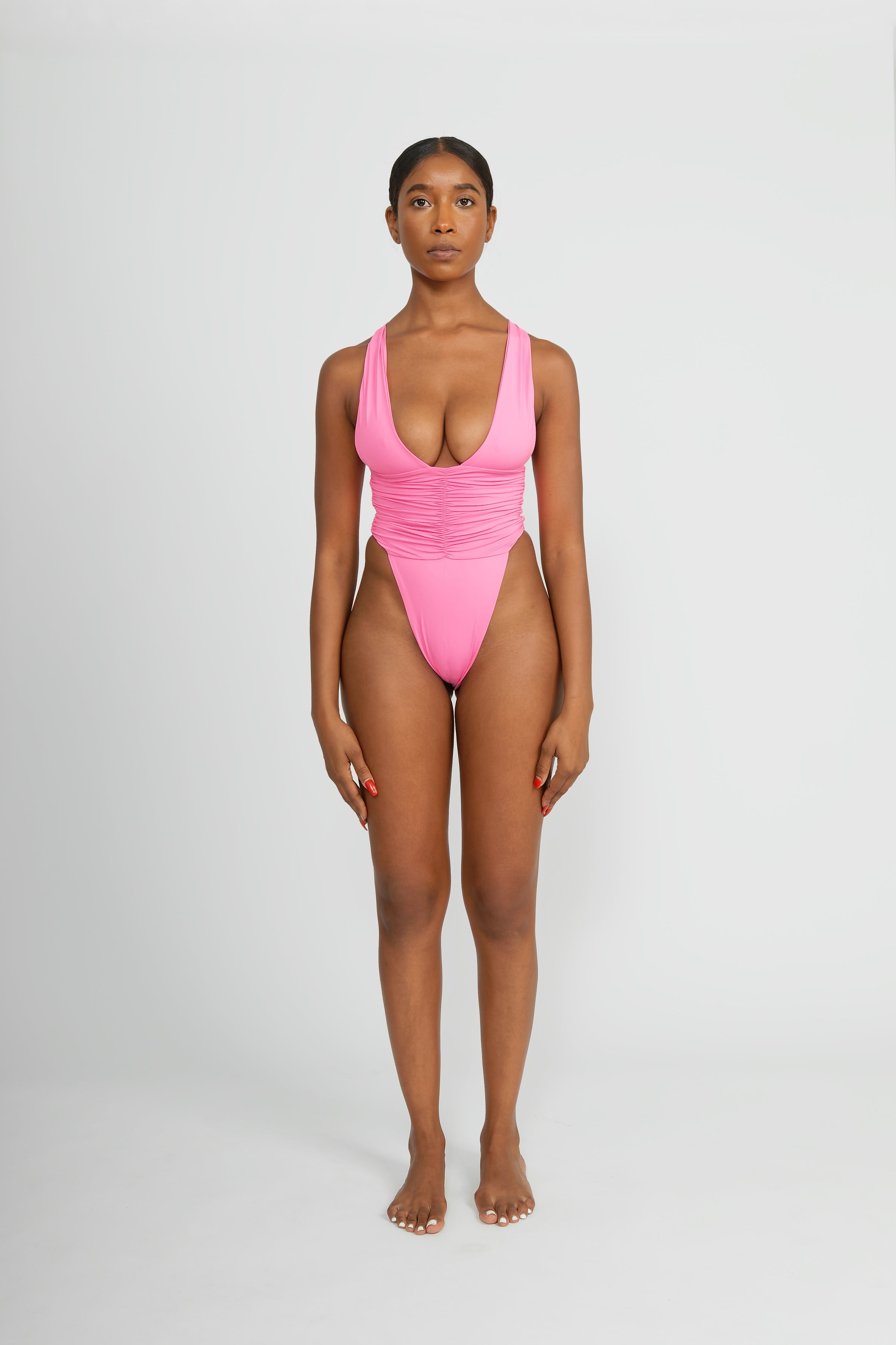 One-Piece Swimsuit with Thong Back and Ruched Sides in a Barbie Pink Color